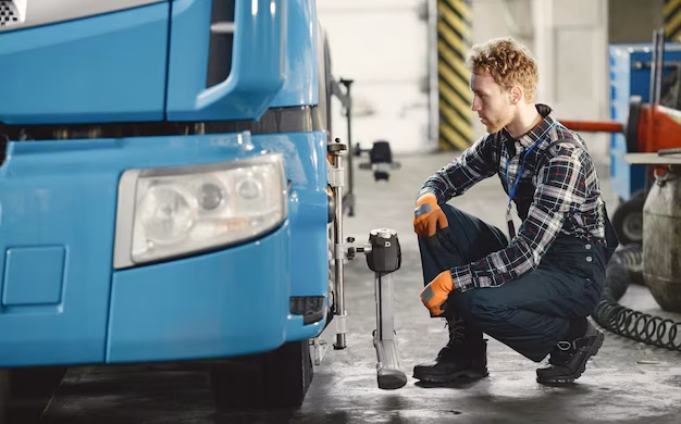 car-mechanic-repairs-car-garage-with-tools_1157-46540